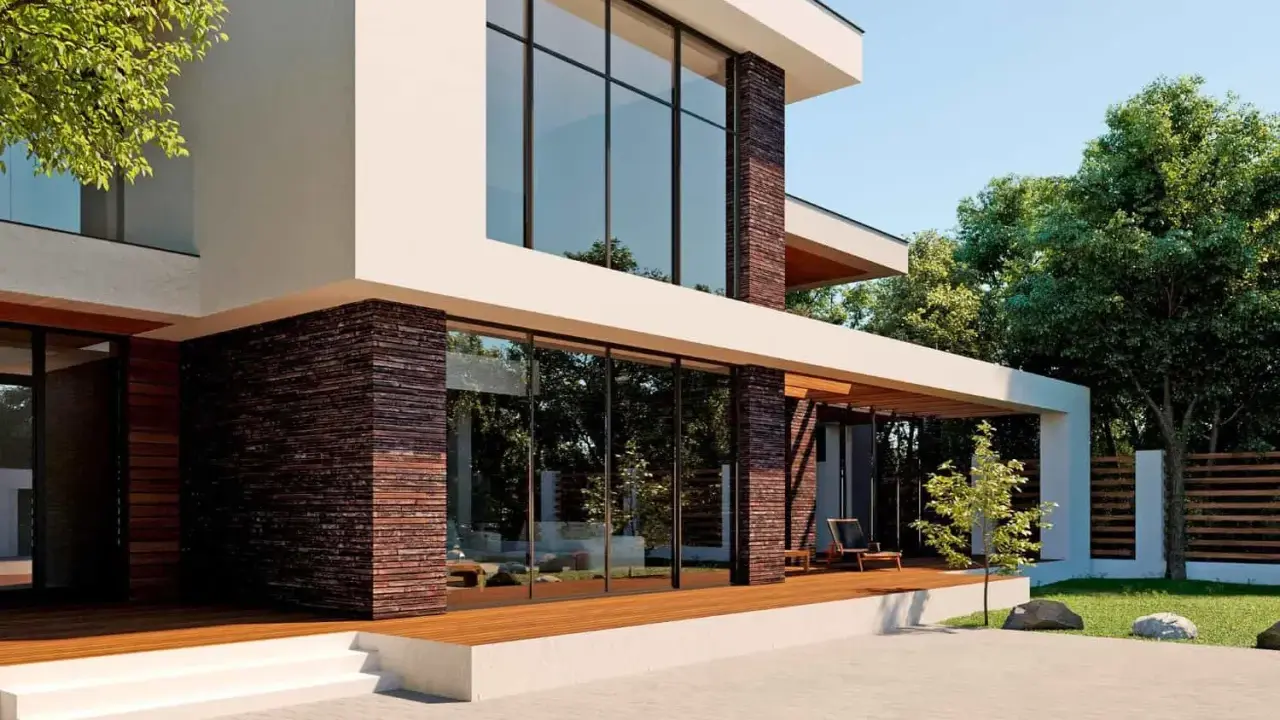 Fachadas de casas modernas con grandes ventanales y detalles en piedra. Una terraza de madera invita a disfrutar del exterior.