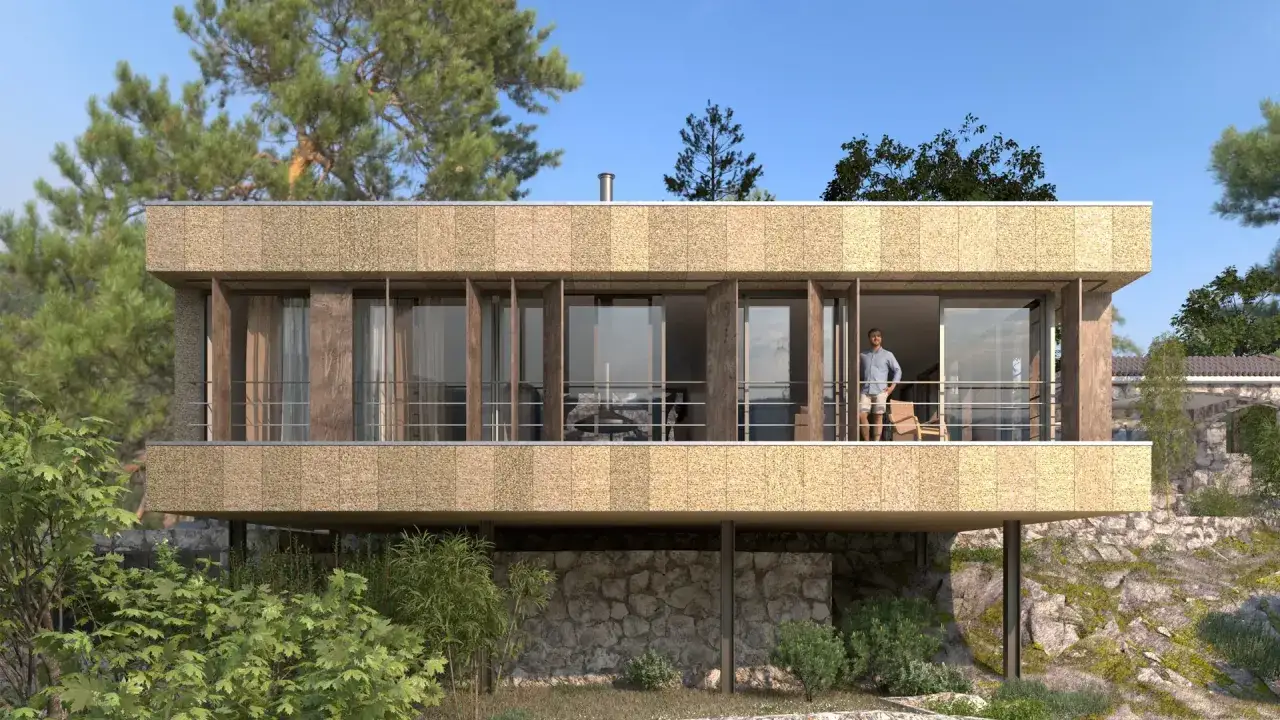 Modernas fachadas de casas con revestimiento texturizado y amplios ventanales que se integran al paisaje rocoso y arbolado.